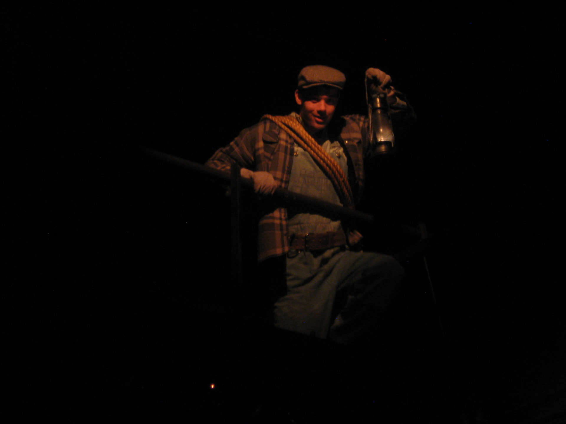 Floyd Collins — Floyd on the platform holding a lantern aloft